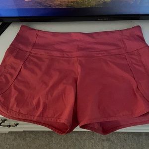 WORN TWICE. light pink/red lululemon shorts!! Super comfortable!!